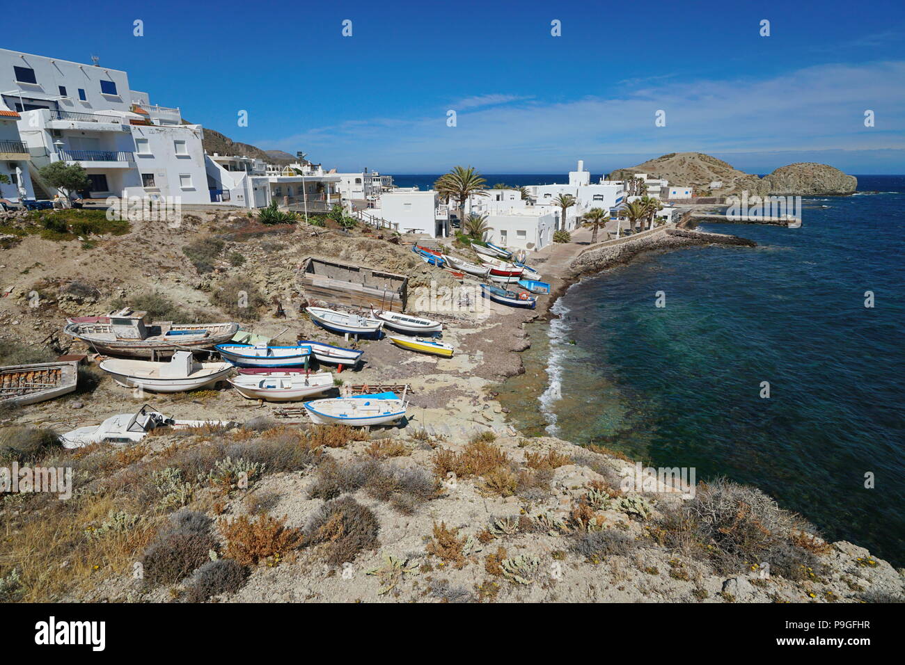 Typical fishing village La Isleta del Moro with small boats on the shore of the Mediterranean sea, Cabo de Gata-Níjar natural park, Andalusia, Spain Stock Photo