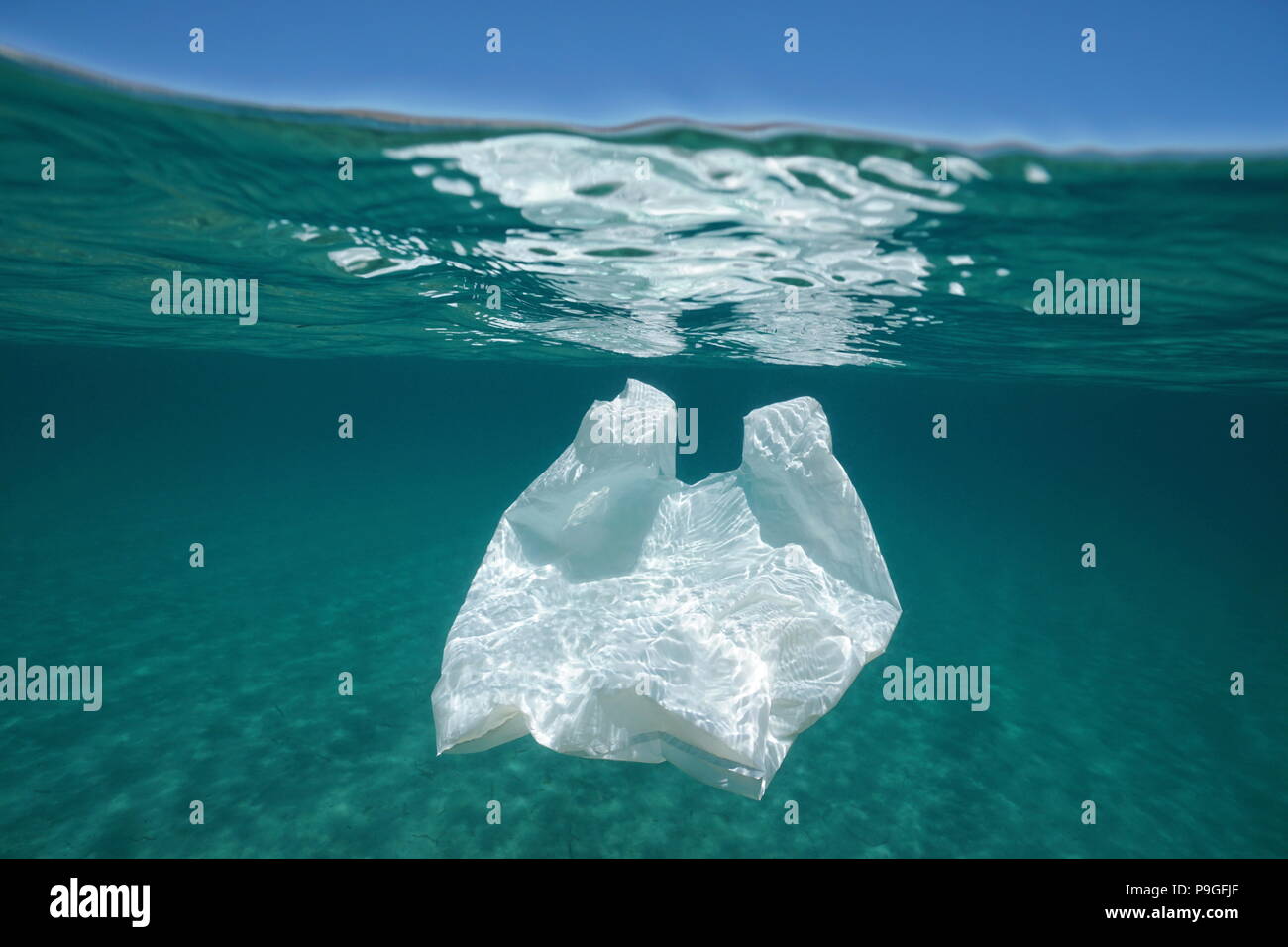 Underwater pollution a plastic bag adrift in the Mediterranean sea below water surface, Almeria