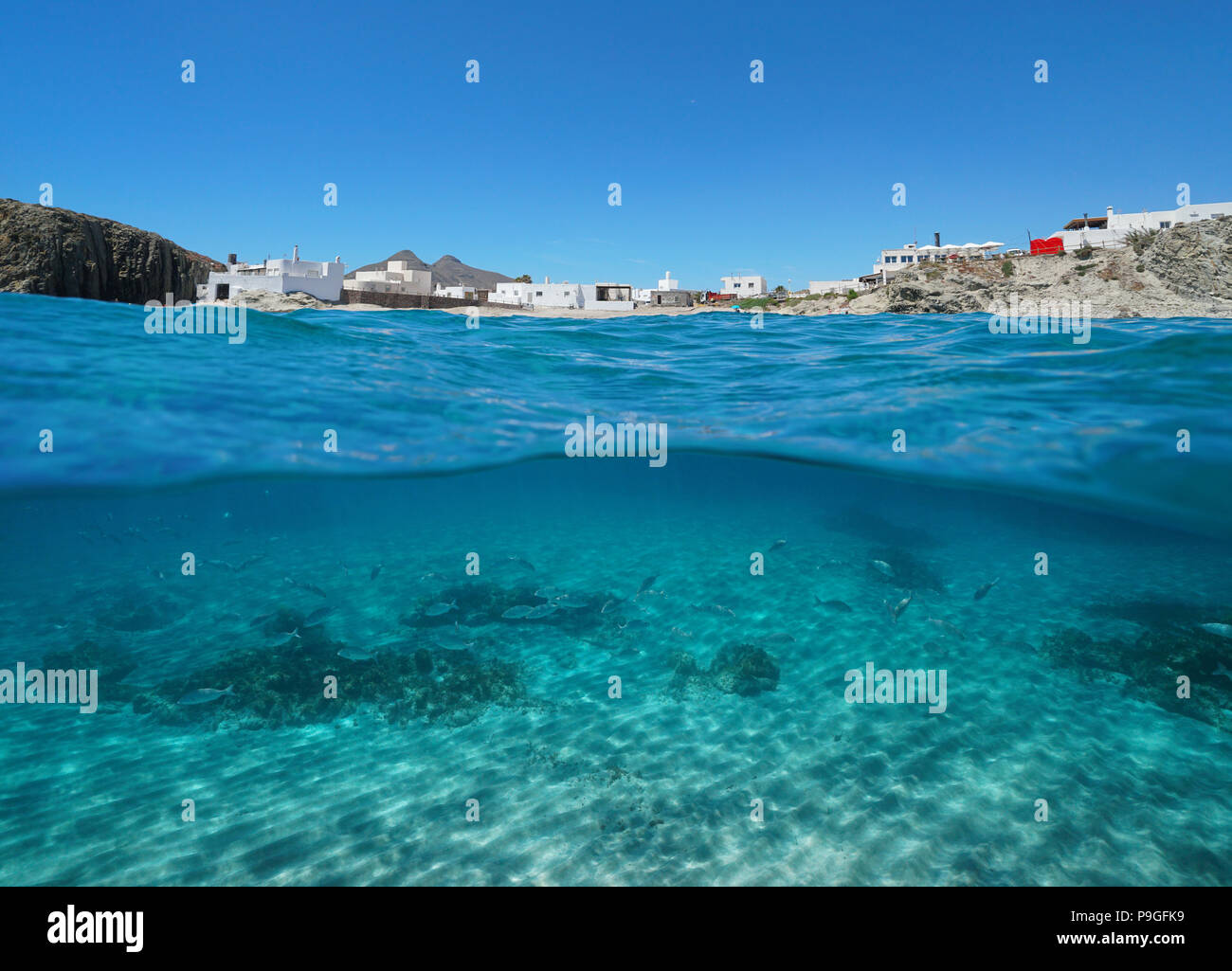 The village La Isleta del Moro on the seashore with fish and sand