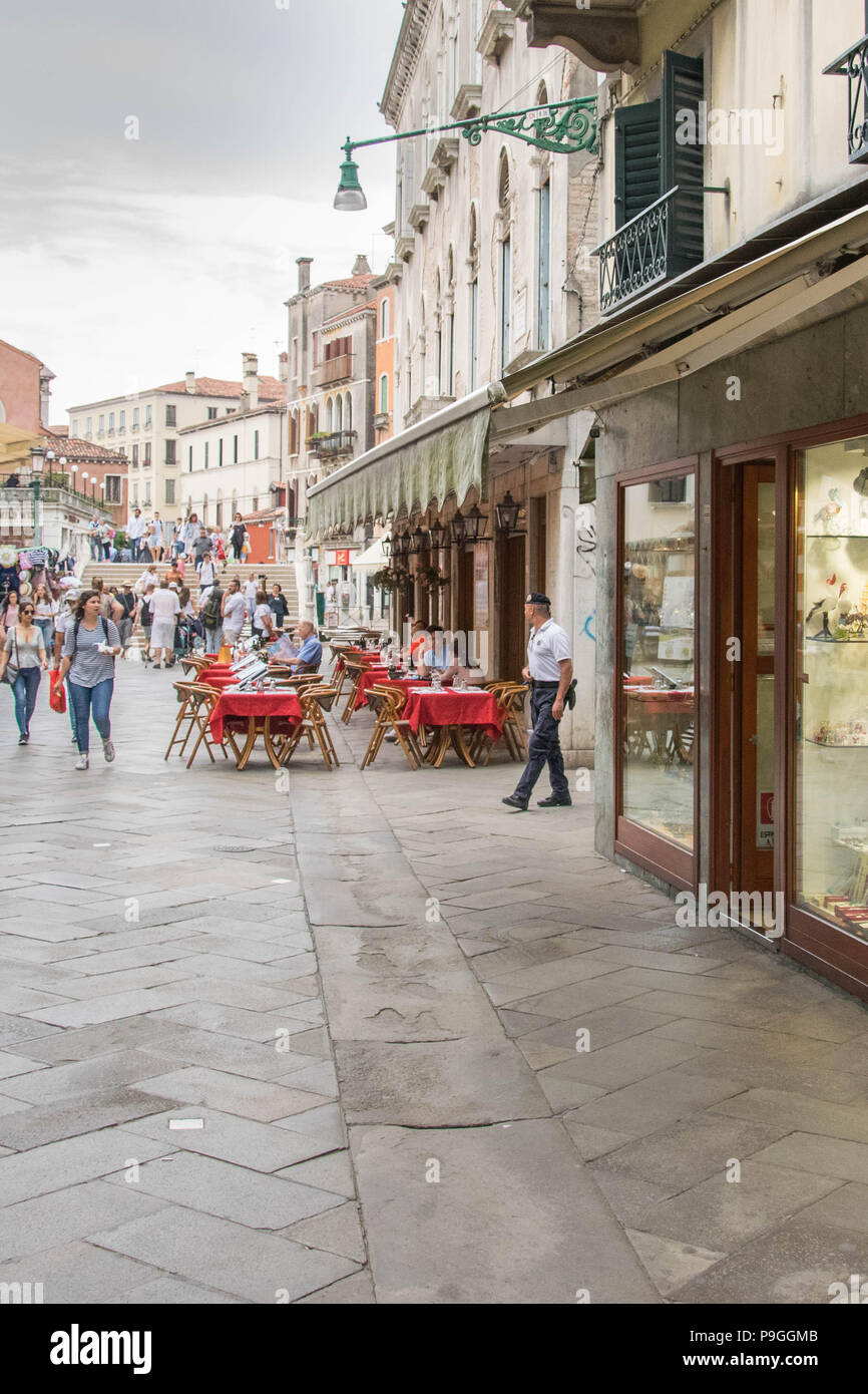 Europe, Italy, Venice. Police officer on duty, safety patrol on