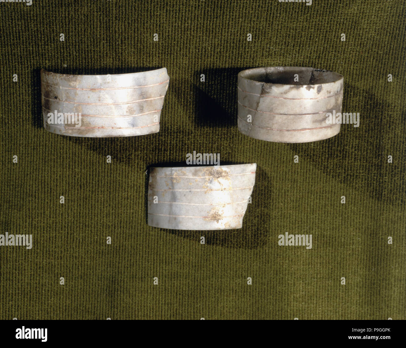 Marble bracelets decorated with parallel carved lines, from the Bat Cave, Zuheros (Córdoba). Stock Photo