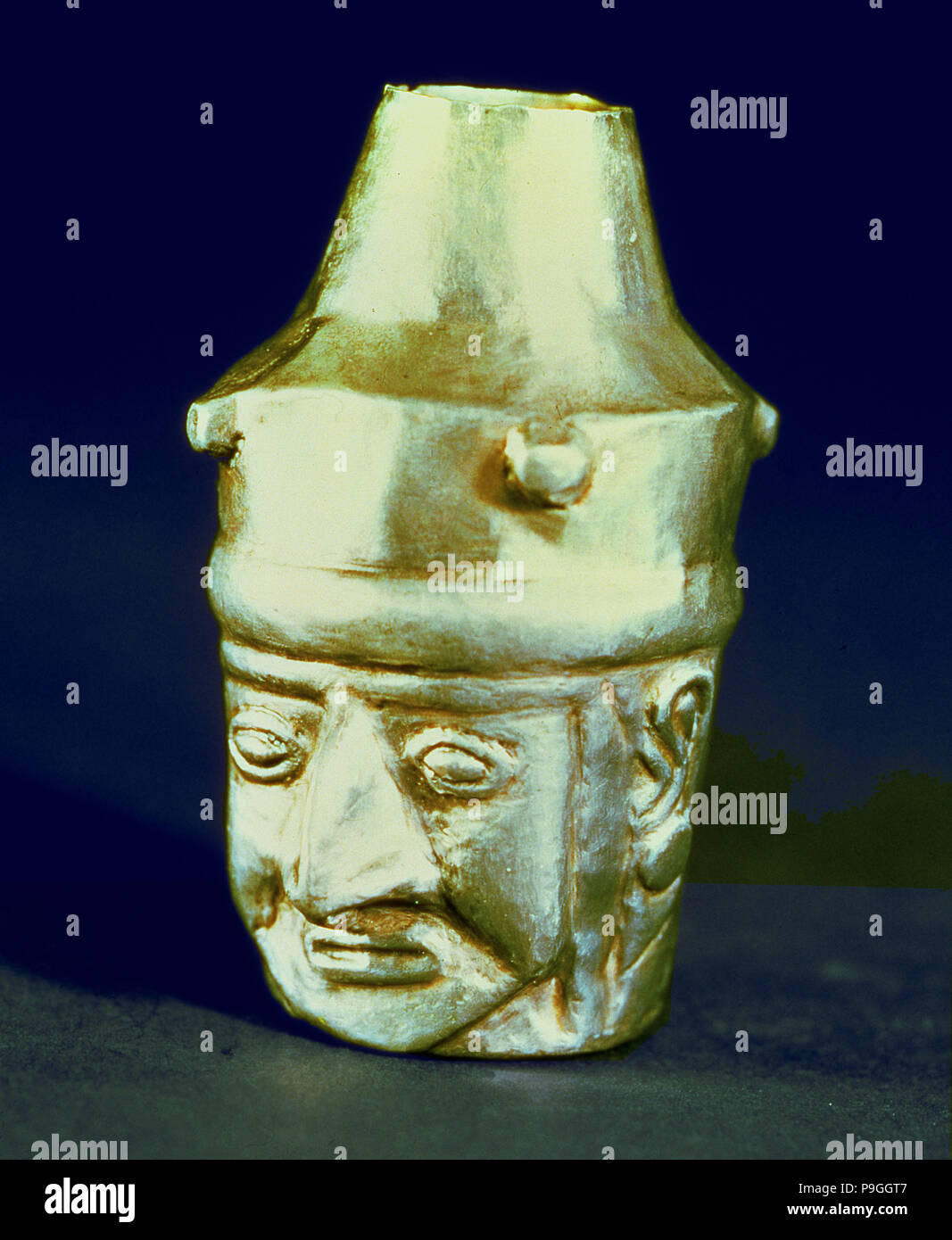 Anthropomorphic head shaped vase, made of silver and representing a