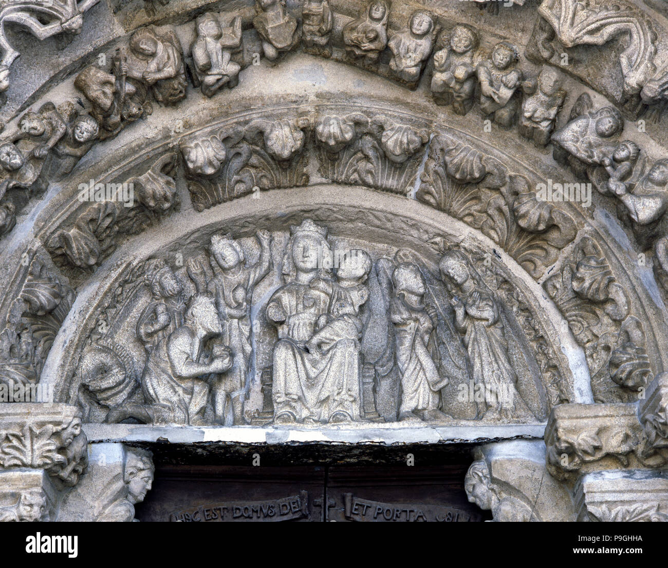 Church of Santa Maria de Azogue, detail of the Sculptures of the tympanum with the image of the V… Stock Photo