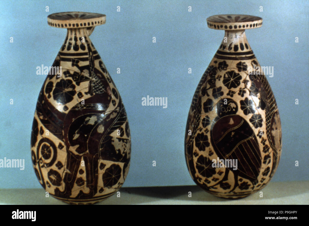 Corinthian vases decorated with black figures of animals, fantastic creatures and floral motifs. Stock Photo