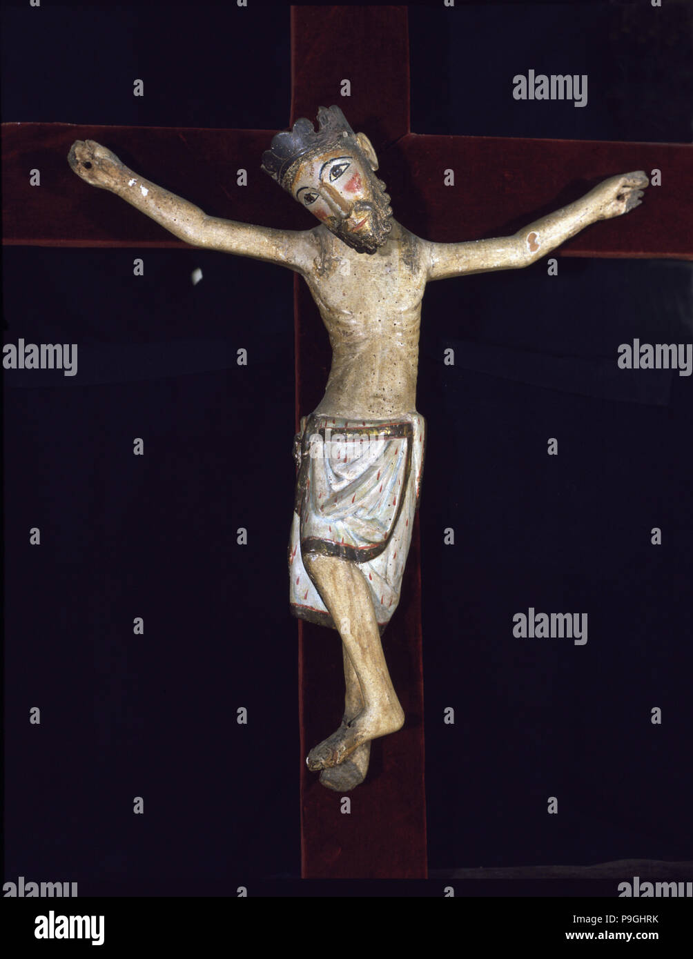 'Christ of Solsona', polychromed wood carving, Christ crucified with feet together by a single n… Stock Photo