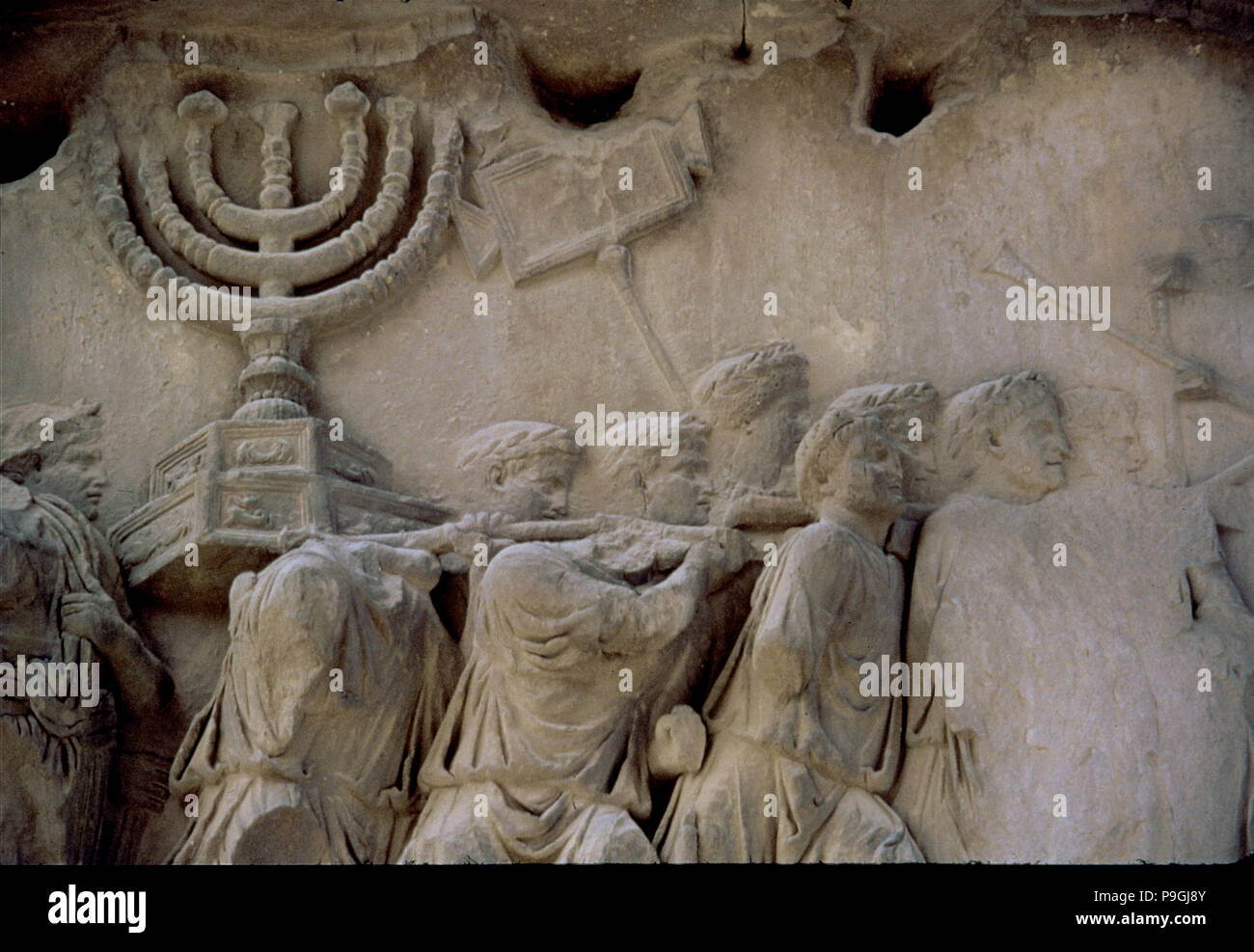 Basrelief in the Arch of Titus representing men carrying a menorah, located in the Via Sacra of t… Stock Photo