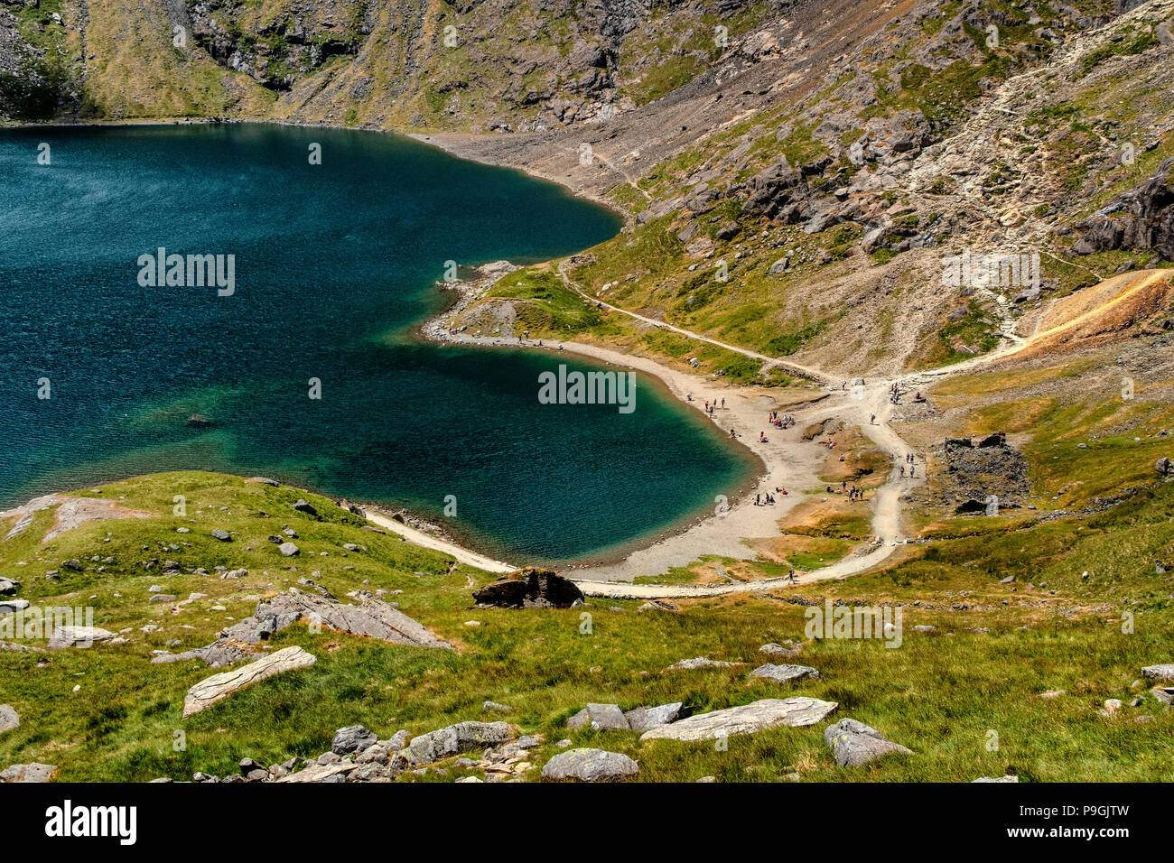 Llyn Glaslyn at the base of the east face of Snowdon, the highest mountain in Wales during summer. Stock Photo