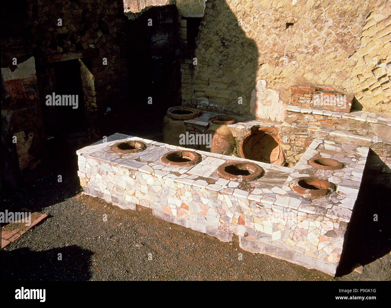Termopolio ruins, hot food shop, located on Cardo V street, located on the ruins of Herculaneum. Stock Photo