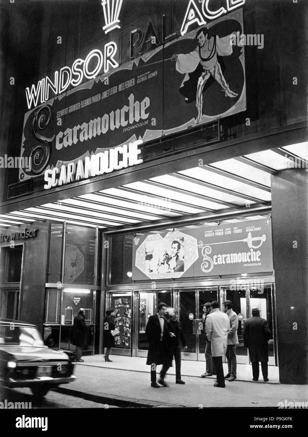 Façade of old cinema Windsor in Barcelona with neon signs advertising the film Scaromouche, 1952. Stock Photo