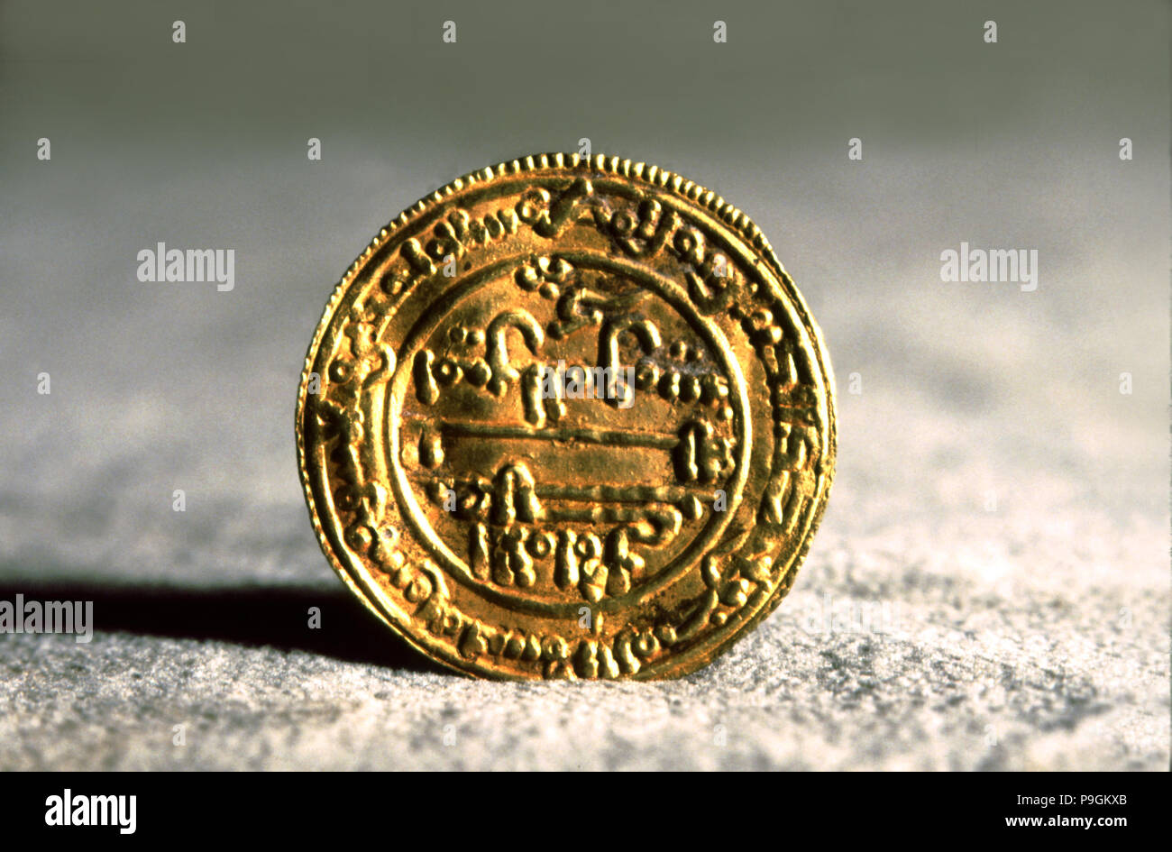 Andalusian gold dinar, also called 'Mancuso', used in Catalan counties during feudal times. Stock Photo