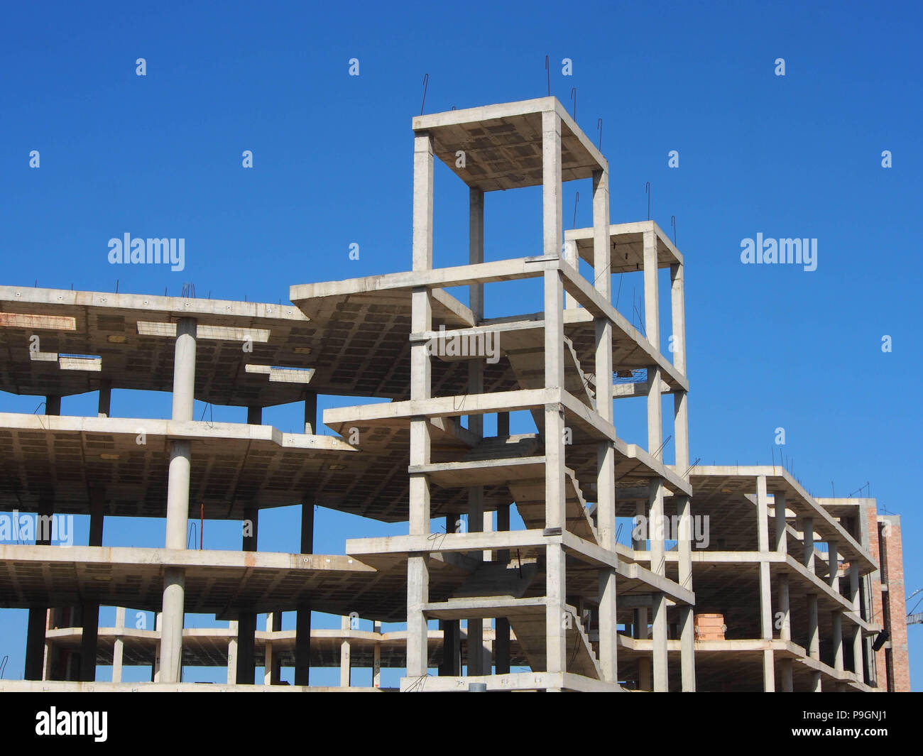 A half built shell of an abandoned hotel construction in Ibiza, Spain Stock Photo