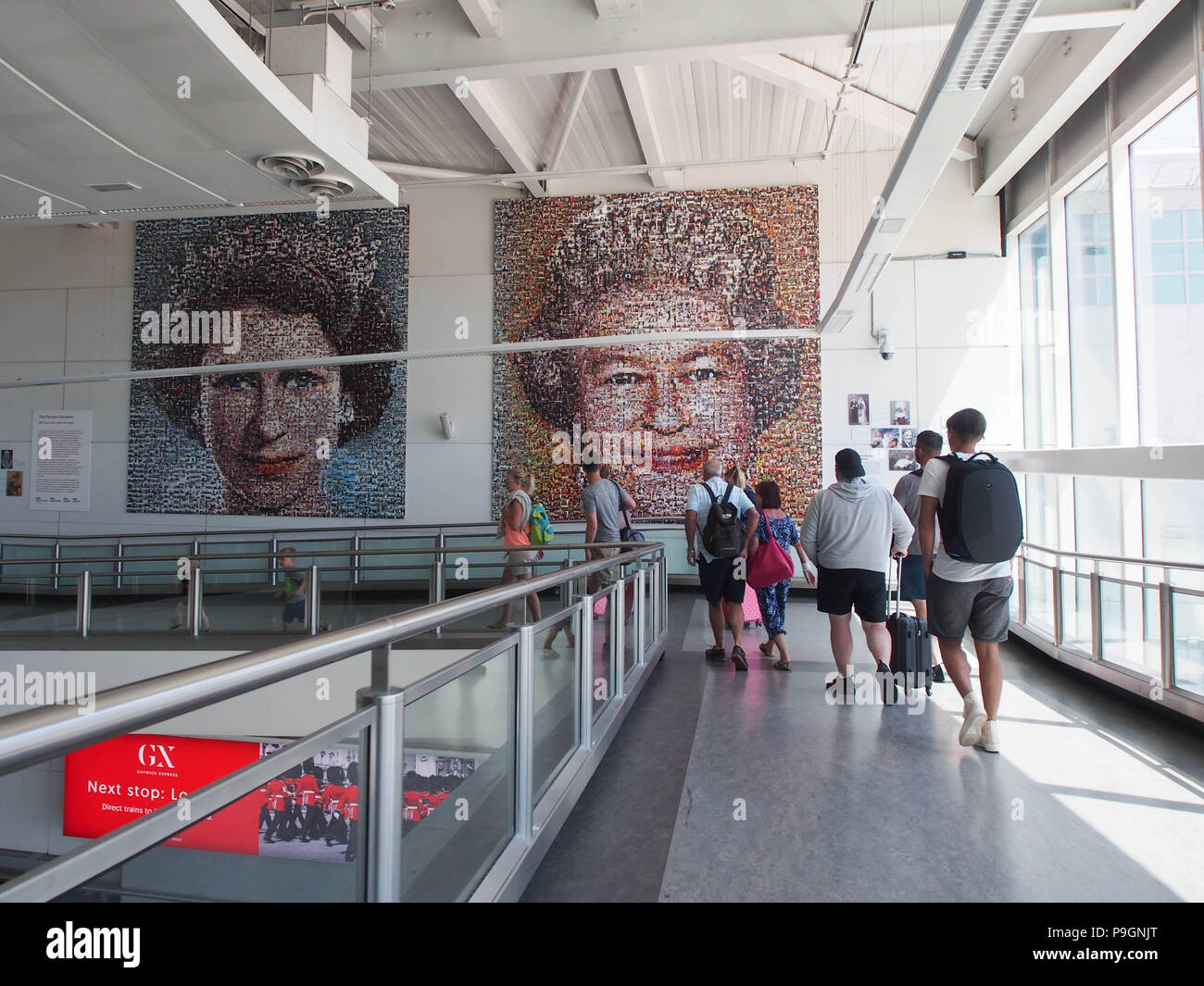 Passengers walk past the artwork “The People’s Monarch” by British artist Helen Marshall at the South Terminal of Gatwick airport, London. Stock Photo