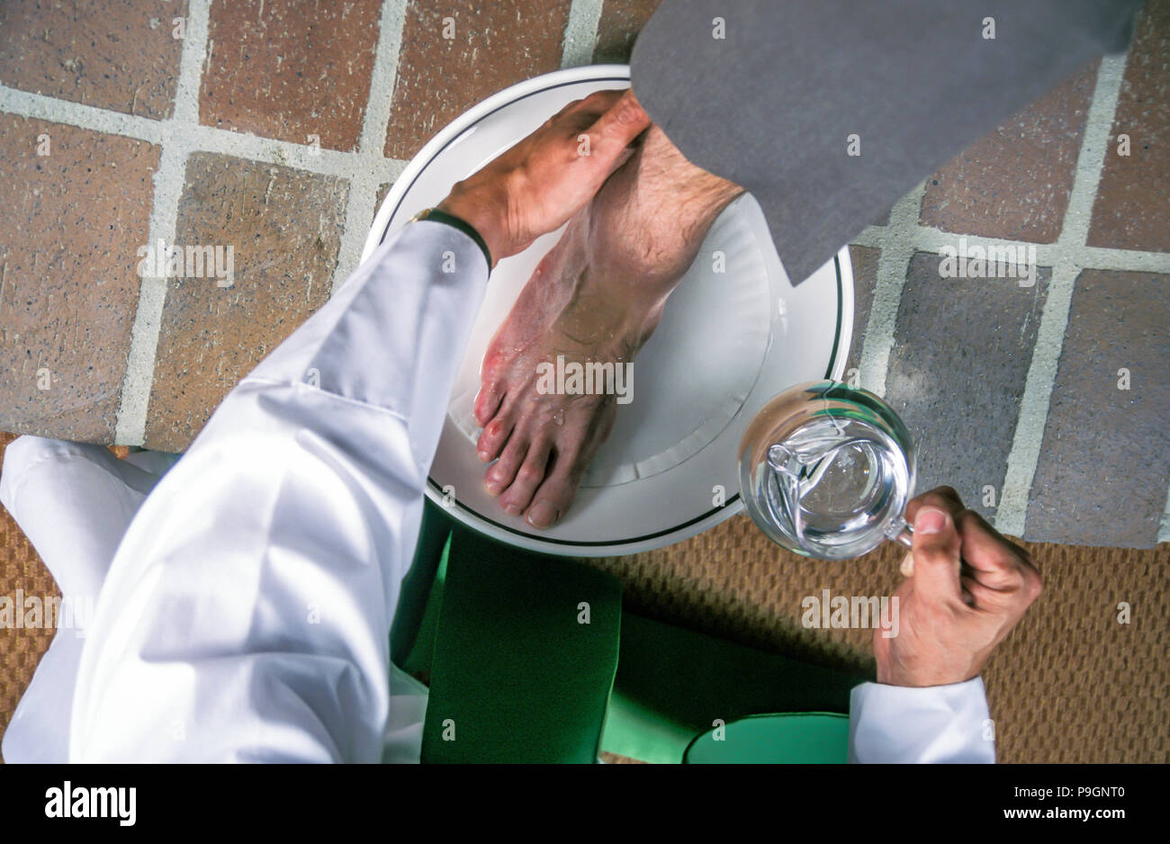 Catholic Priest washing the feet of a parishioner  MR  © Myrleen  Pearson........Ferguson Cate Stock Photo