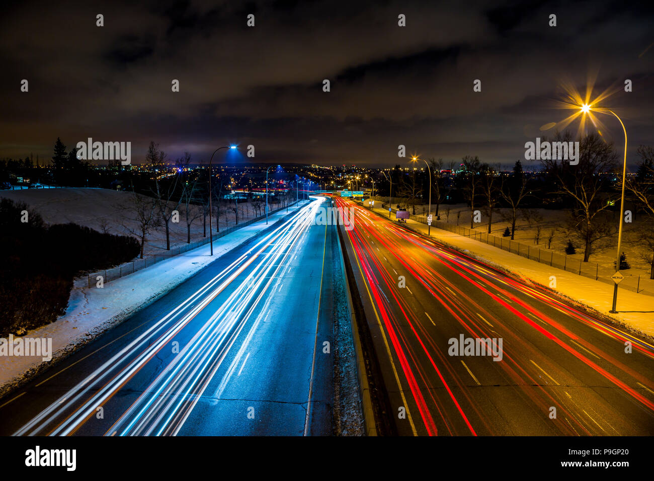 A long exposure of traffic at night along Calgary's Crowchild Trail near the Bow River in Alberta, Canada. Stock Photo