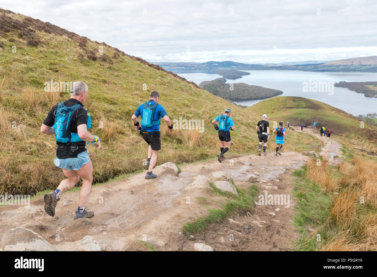Trail runners descending off Conic Hill in Loch Lomond and Trossachs National Park in the Highland Fling 53 mile Ultra Trail Marathon 2018 Stock Photo
