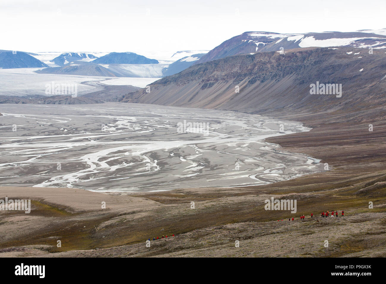 Tourists and a Braided River in Svalbard Arctic Stock Photo