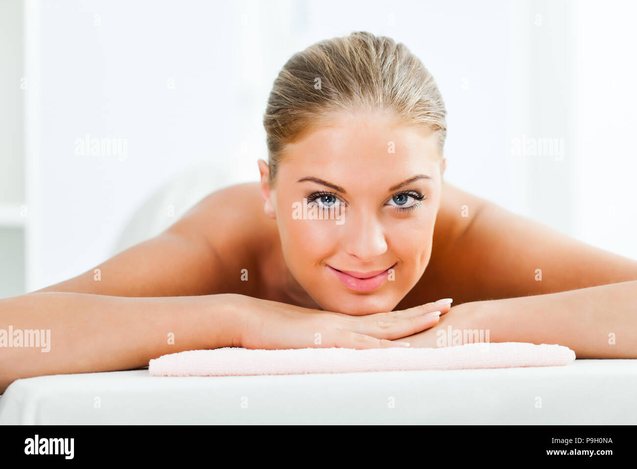 Young woman relaxing after massage on spa treatment Stock Photo Alamy