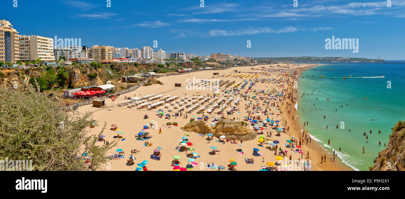 Praia da Rocha main beach in mid summer Stock Photo