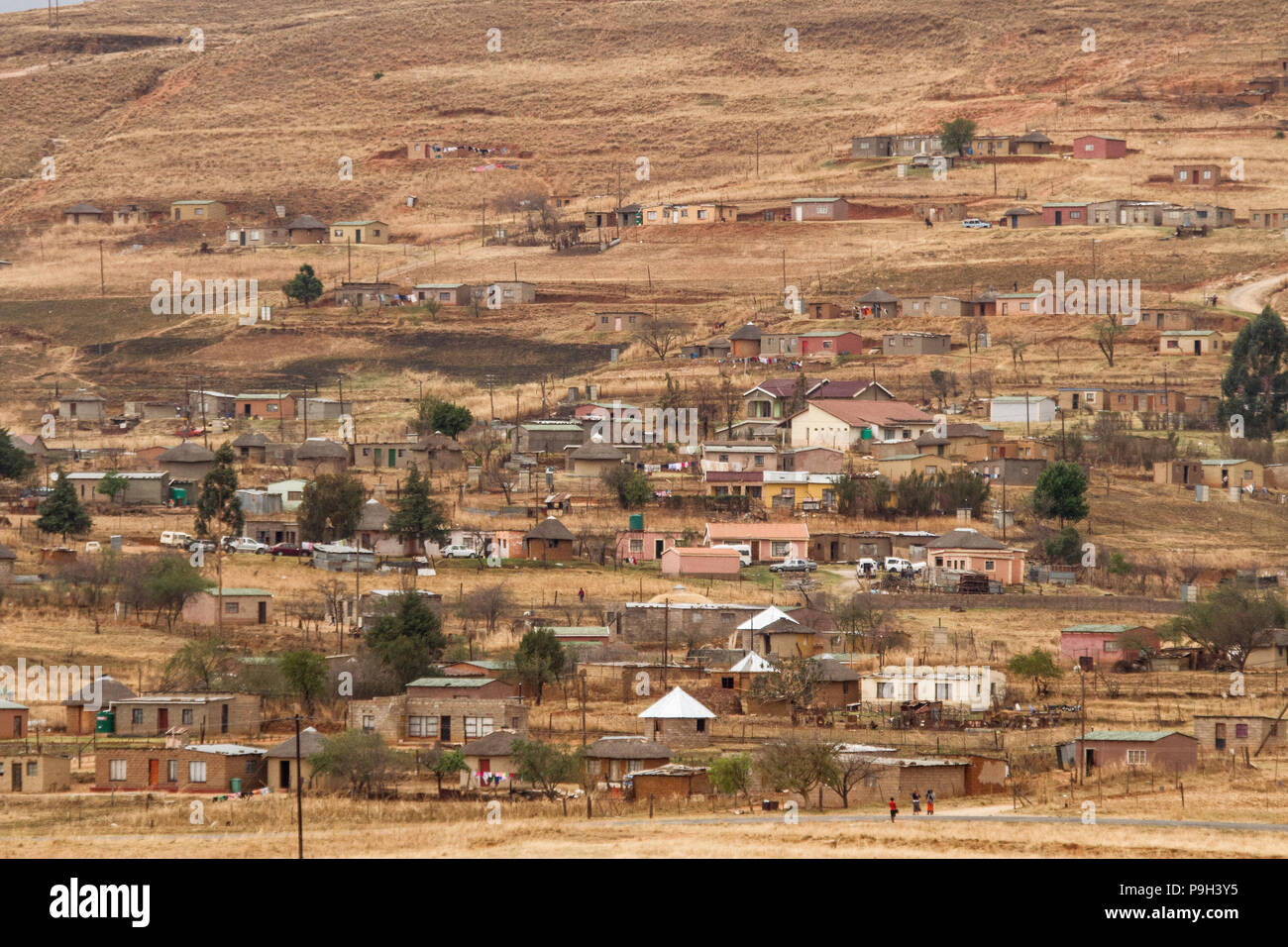 A village on a brown hillside, near Bergville, KwaZulu Natal, South Africa. Stock Photo