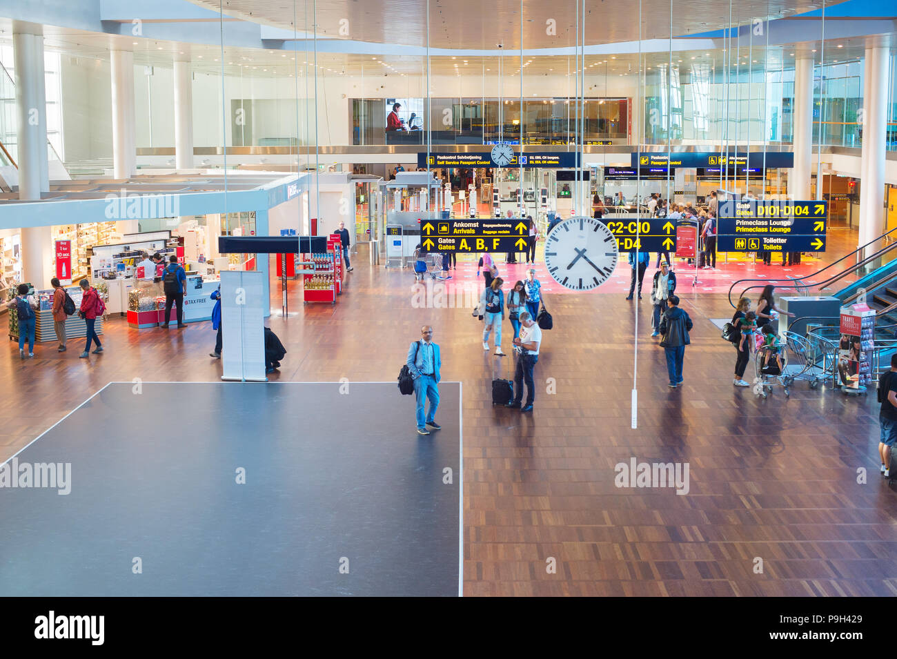 COPENHAGEN ,DENMARK - JUNE 13, 2018: People at Kastrup airport hall in Copenhagen. Kastrup is the main international airport serving Copenhagen, Denma Stock Photo