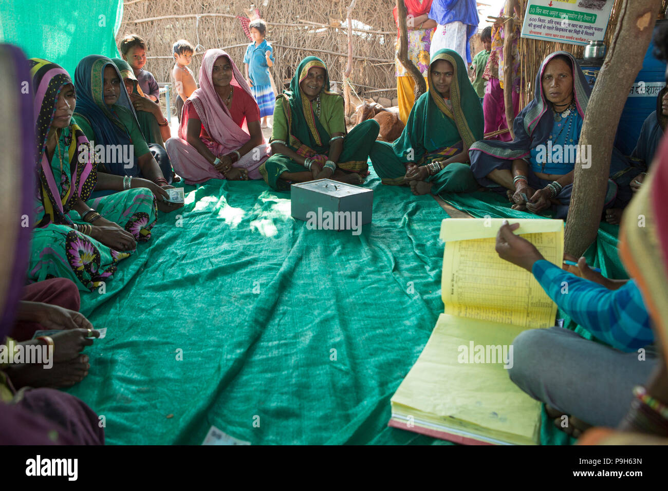 A local farmer training school meet to share their loan money and learn about making organic fertiliser for their farms, Madhya Pradesh, India. Stock Photo