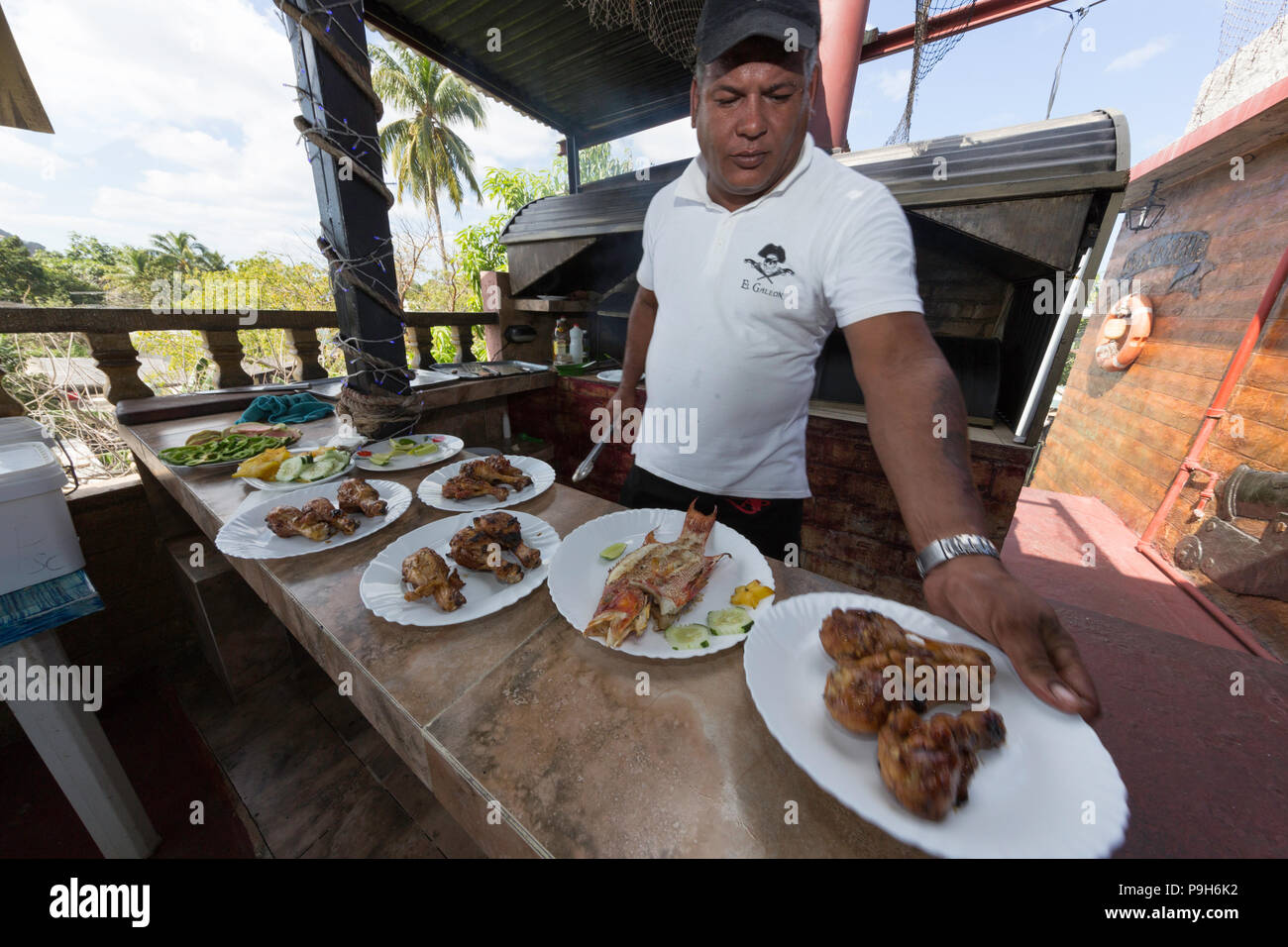 Fresh caught fish being prepared at a private restaurant in Nueva Gerona on Isla de la Juventud, Cuba Stock Photo