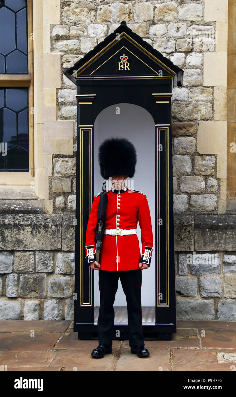 A member of the Queens Guard stands sentinal at the Tower of London in London, England. Stock Photo