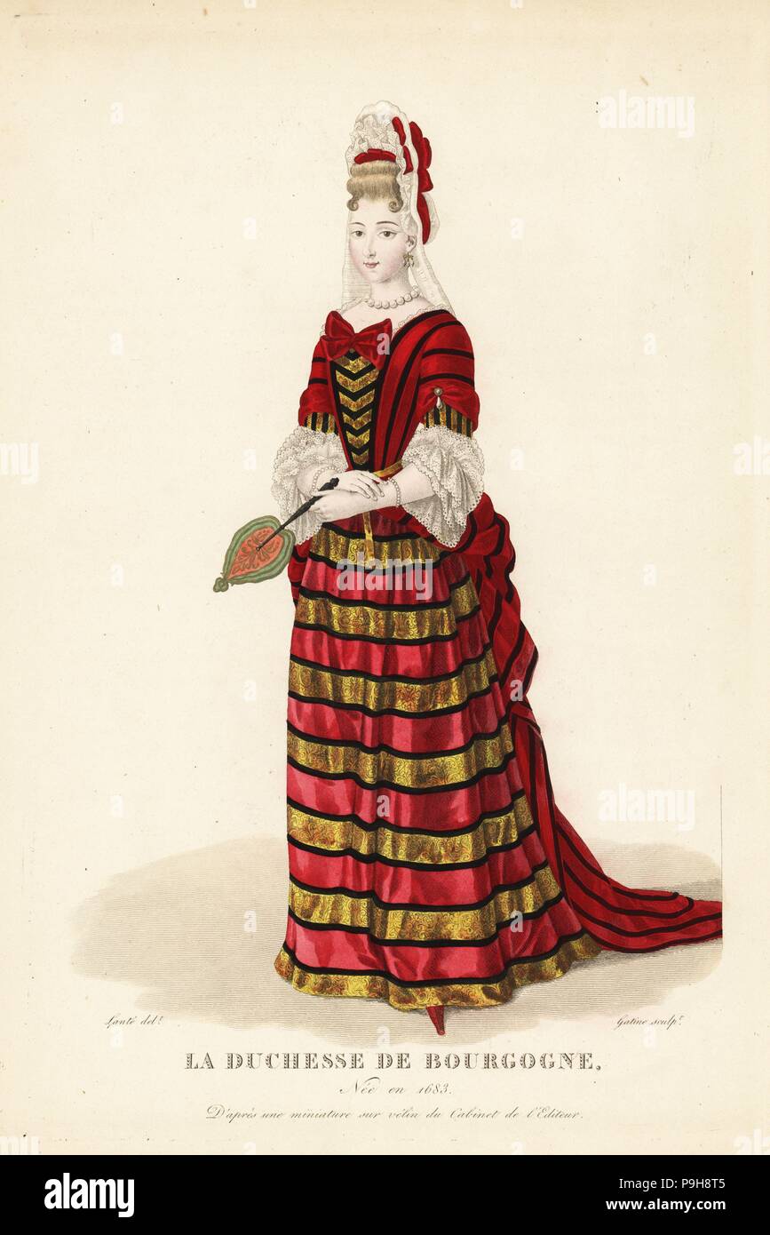 Marie Adelaide de Savoie, Duchess of Burgundy, 1683-1712. She wears a tall lace Fontanges headdress with ribbons, striped mantua with train, lace sleeves, and petticoat with gold bands. After a miniature on vellum in the editor's collection. Handcoloured copperplate engraving by Georges Jacques Gatine after an illustration by Louis Marie Lante from Galerie Francaise de Femmes Celebres, Paris, 1827. Stock Photo