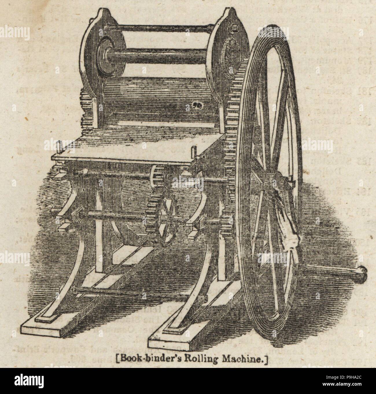 Book-binder's rolling machine. The sheets of paper that make up the book are squeezed and rolled into a solid bookblock. Woodblock engraving from the Penny Magazine, Society for the Diffusion of Useful Knowledge, 1833. Stock Photo