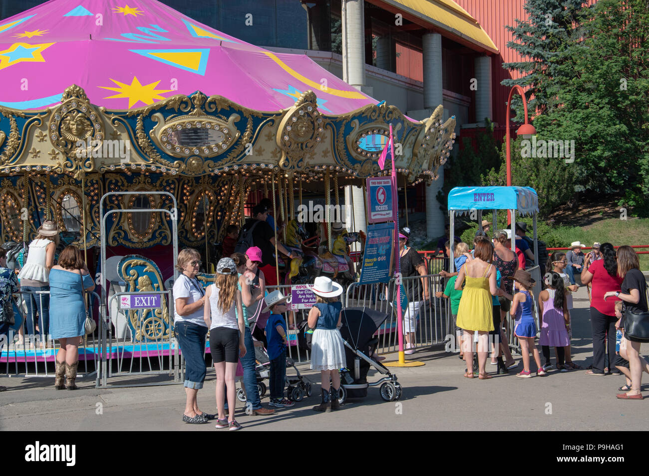 Kids wait for entry into the Carousel ride at the Calgary Stampede