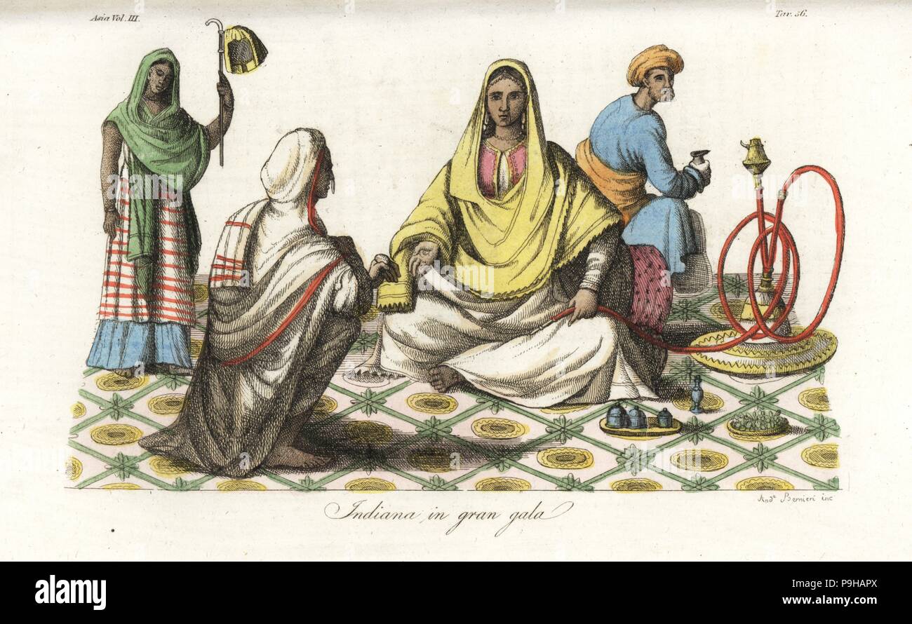 An Indian woman at a gala seated on a rich carpet with containers of betelnut and perfume, attended by an ayah or servants with punya (fan), pawn and snake hookah pipe. Handcoloured copperplate drawn and engraved by Andrea Bernieri from Giulio Ferrario's Ancient and Modern Costumes of all the Peoples of the World, Florence, Italy, 1844. Stock Photo