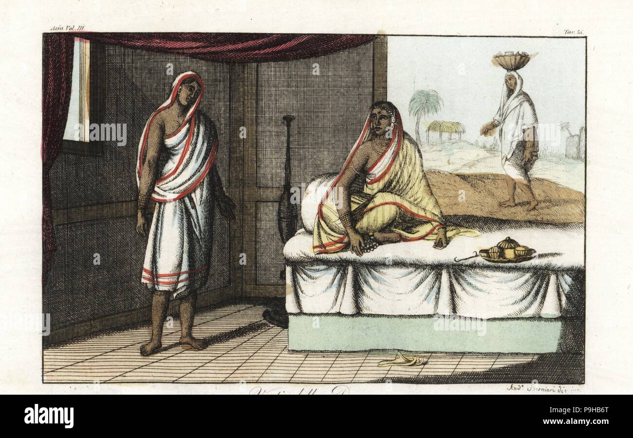 Different types of sari and clothes worn by Indian women. Woman of distinction in sari and veil seated on sofa, and woman of lower rank in short sari. Handcoloured copperplate drawn and engraved by Andrea Bernieri after Francois Solvyns from Giulio Ferrario's Ancient and Modern Costumes of all the Peoples of the World, Florence, Italy, 1844. Stock Photo