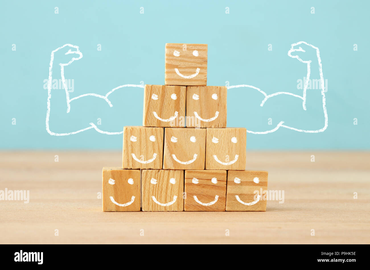 image of wooden blocks with people icons over table ,building a strong ...