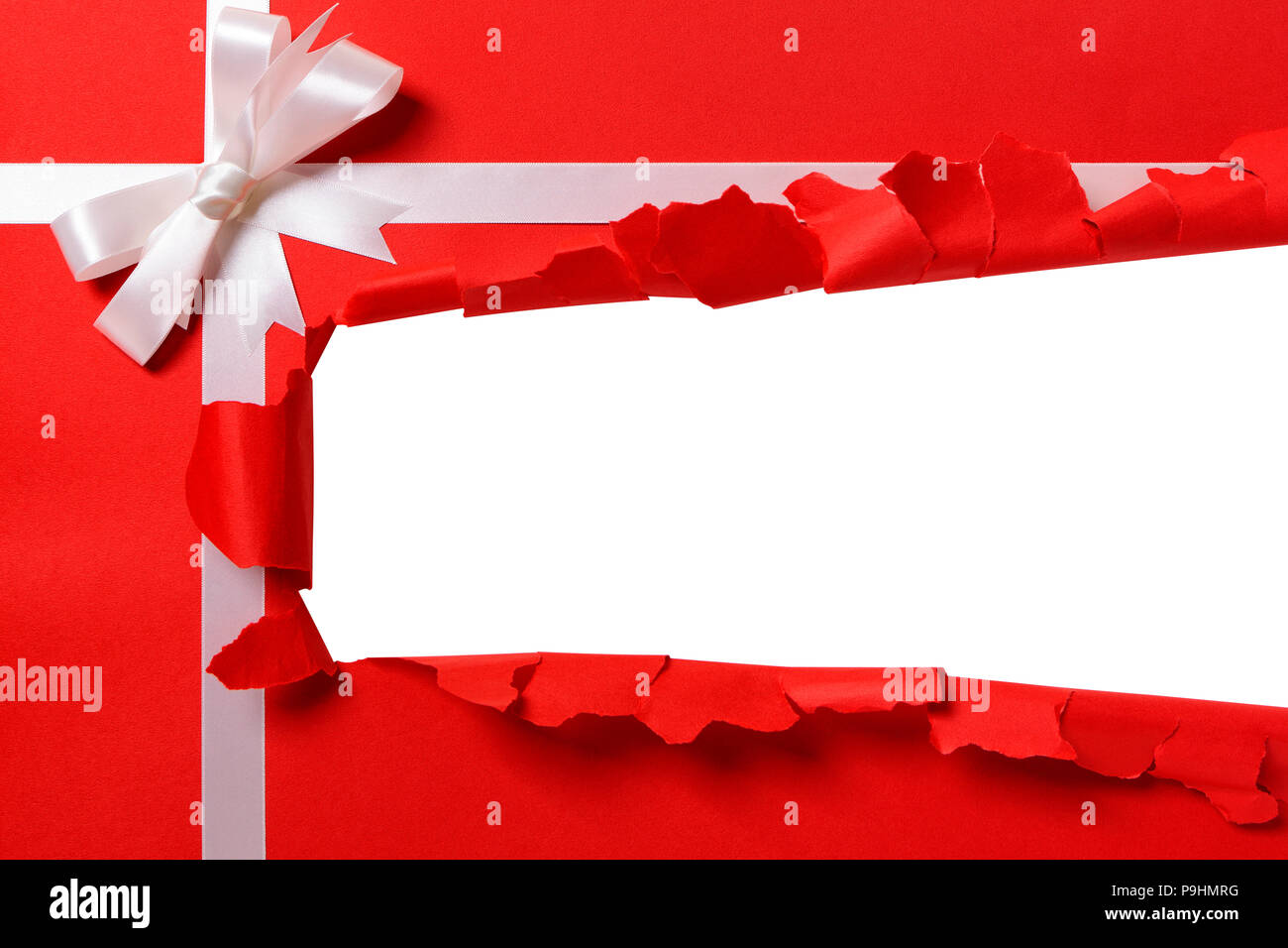 Christmas gift torn open strip, white ribbon bow, red wrapping paper