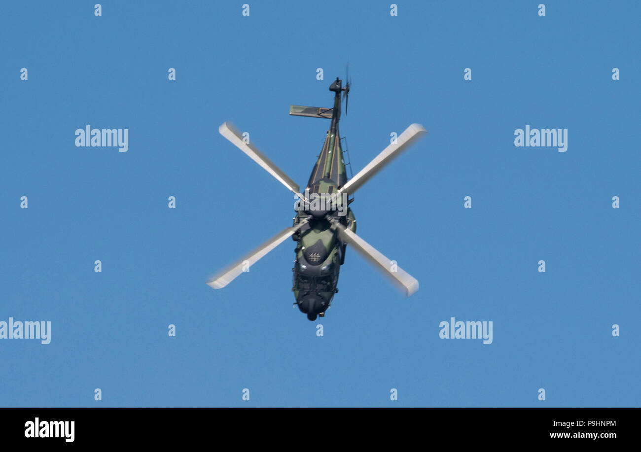 A pilot with the Royal Air Force demonstrates the capabilites of a NH90 tactical helicopter during the 2018 Royal International Air Tattoo at RAF Fairford, United Kingdom on July 14, 2018. This yeat’s RIAT celebrated the 100th anniversary of the RAF and highlited the United States’ ever-strong alliance with the UK. (U.S. Air Force photo by TSgt Brian Kimball) Stock Photo