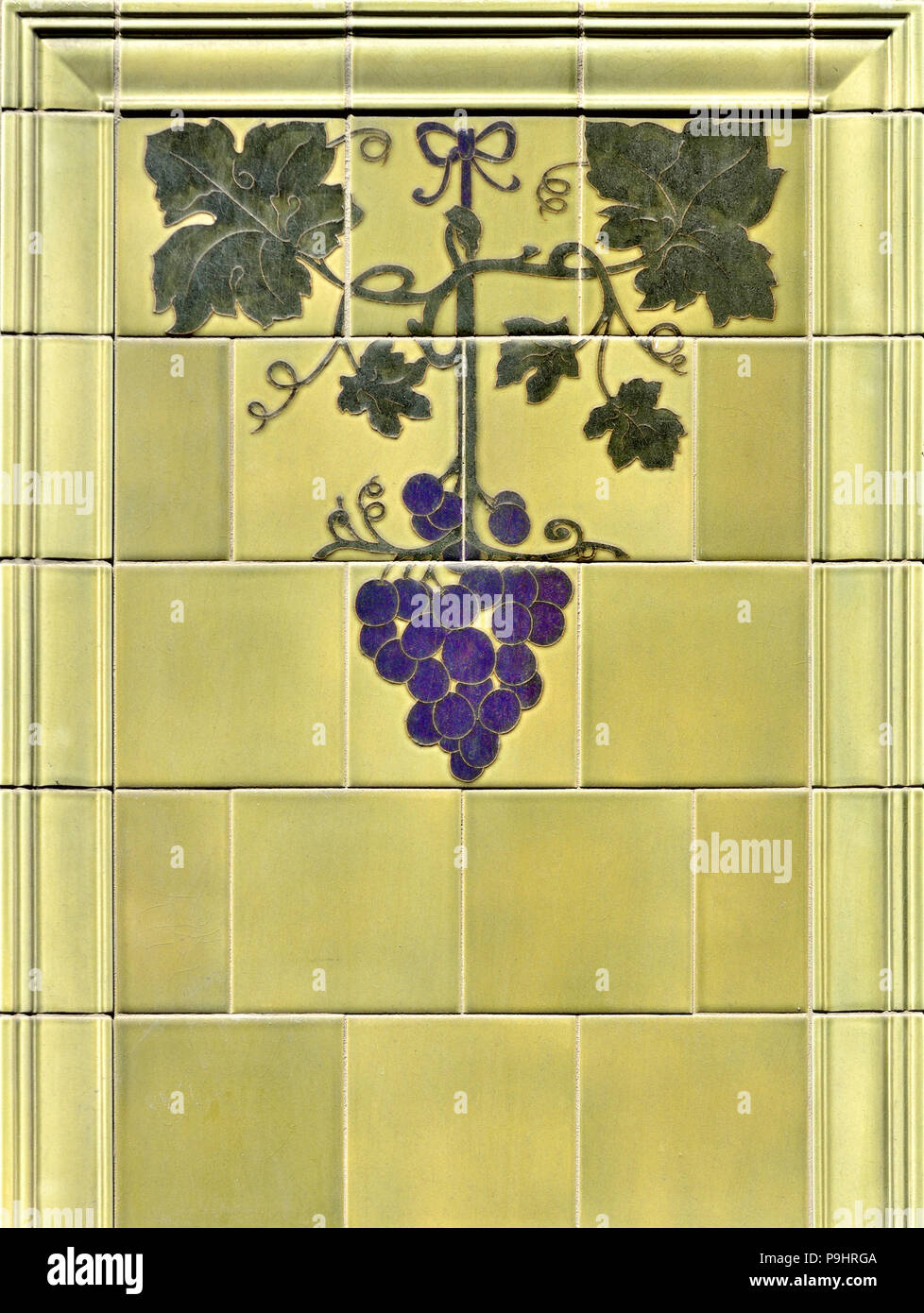 Tiled decoration on the exterior wall of a shop in Earlham Street, Seven Dials, London, England, UK. Stock Photo