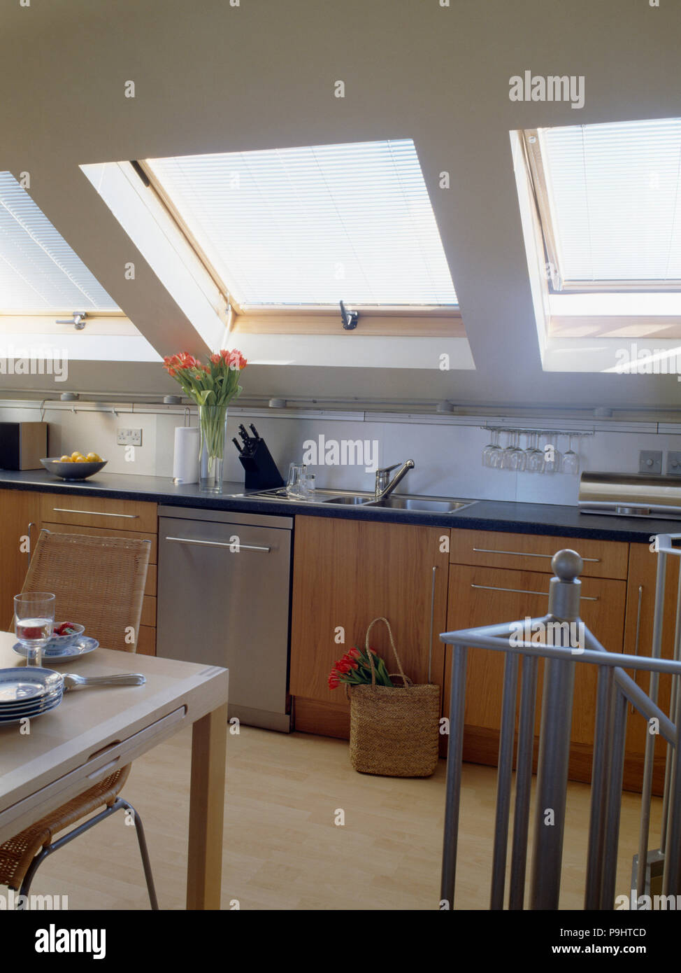 Velux windows in modern attic kitchen Stock Photo