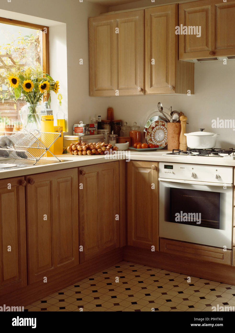 White Oven In Pine Kitchen With Yellow Sunflowers On The