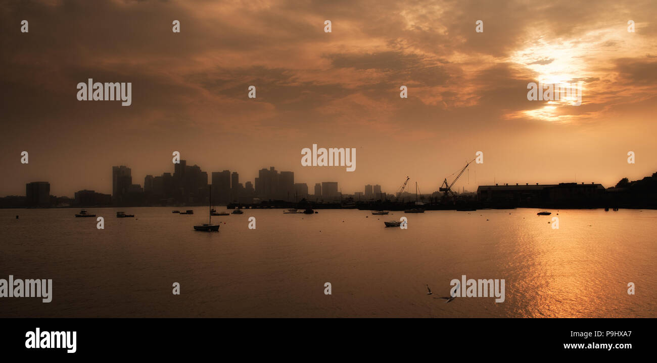 Boston panorama including docks and boats with dramatic clouds during a  summer late afternoon, USA Stock Photo