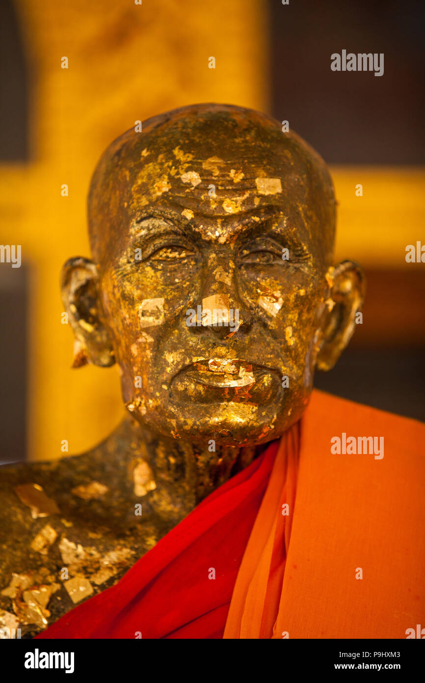 Golden statues of monks within the grounds of the Big Buddha, Thailand