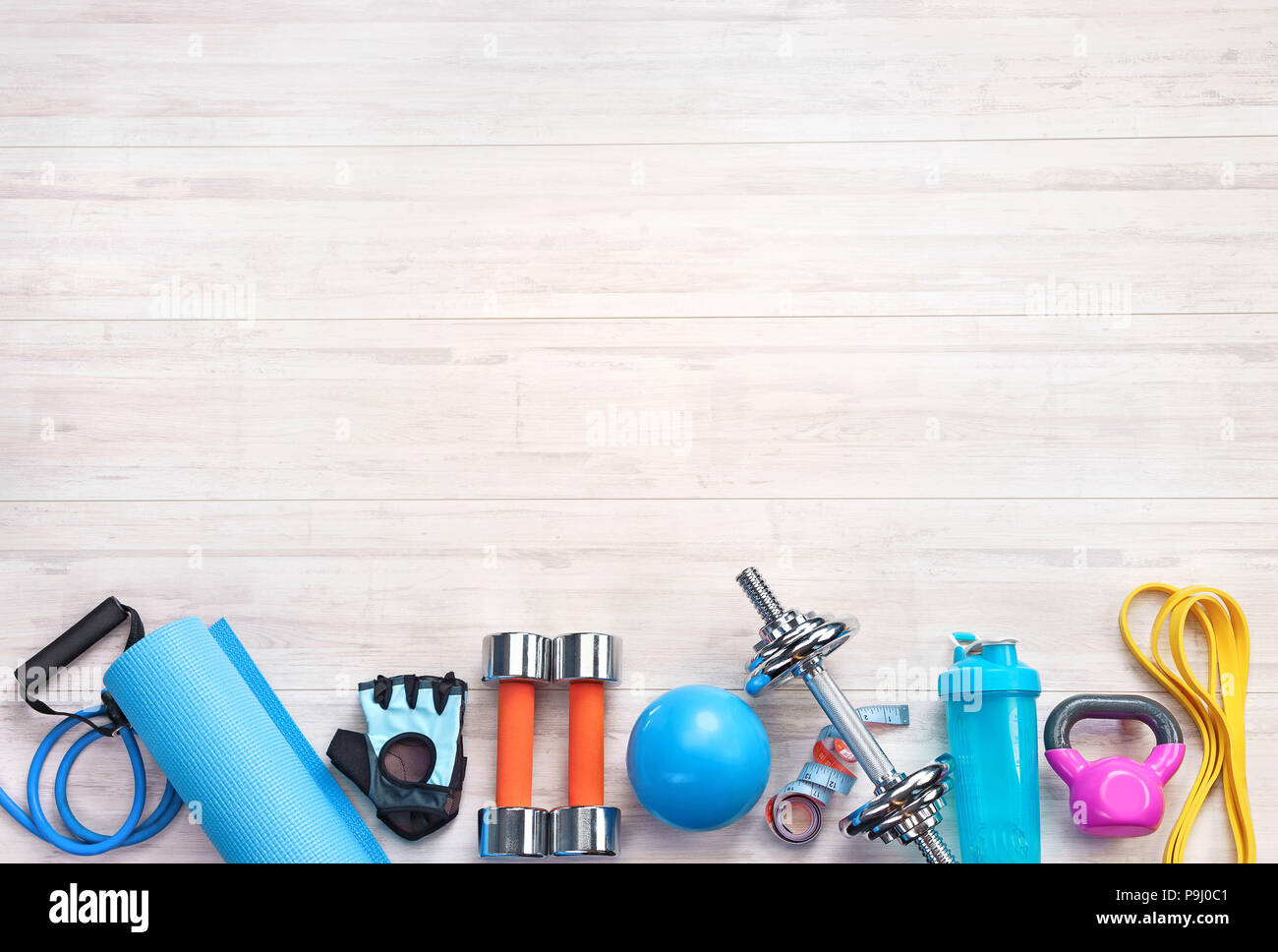 Sports equipment on a white wooden background. Top view. Motivation. Сopy space Stock Photo Alamy