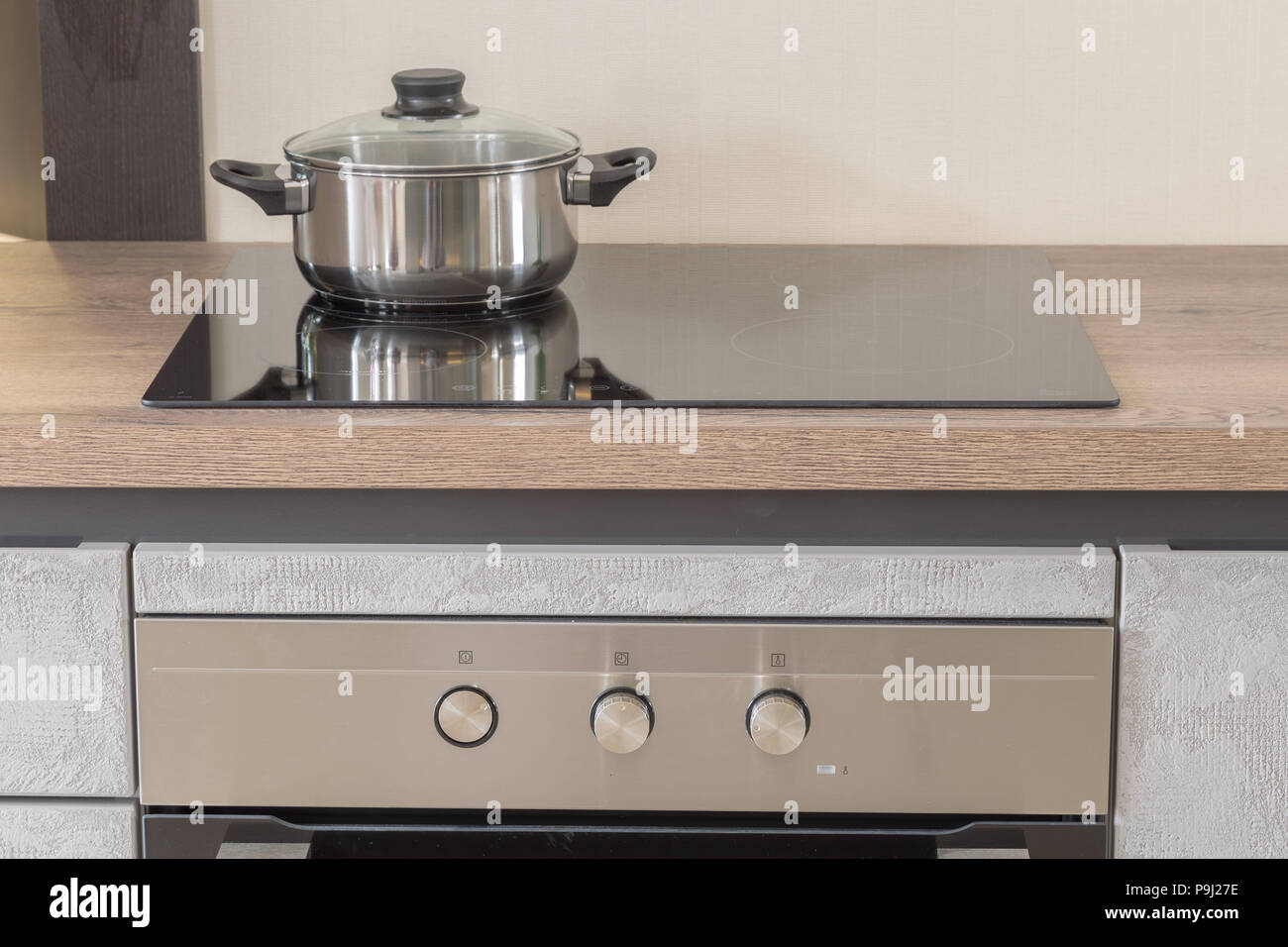 New Design Of Built In Oven And Cooker In The Kitchen Stock Photo