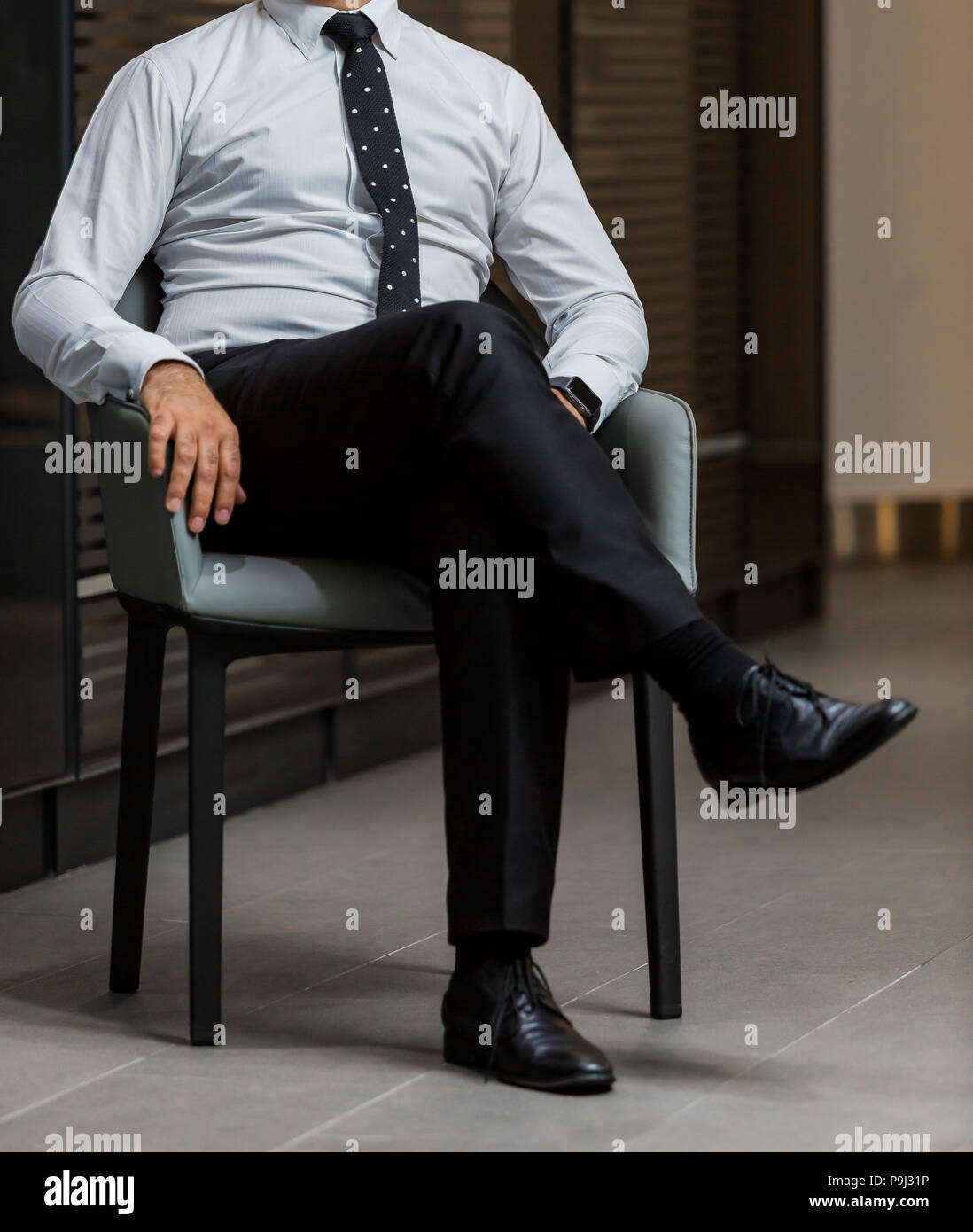 Cropped Head Man in a smart dress shirt and tie in an office chair Stock  Photo - Alamy