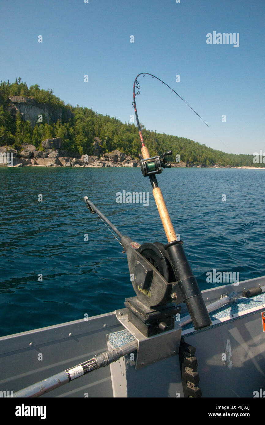 Downrigging fishing rod and downriggers on Bruce Peninsula shoreline