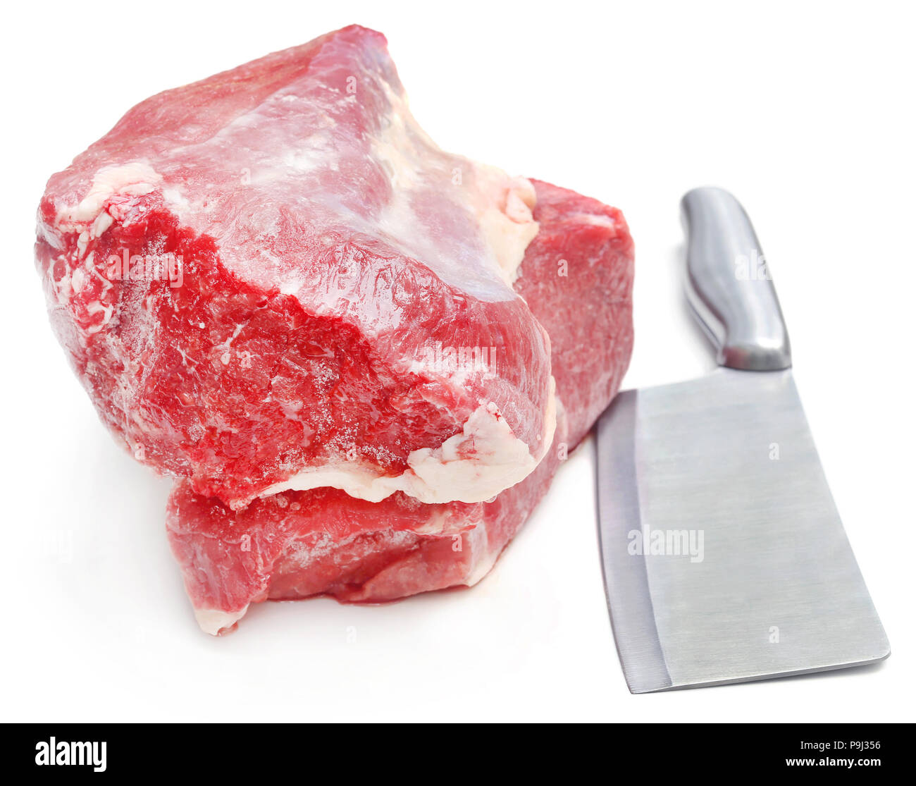 Chunk of beef with kitchen knife over white background Stock Photo