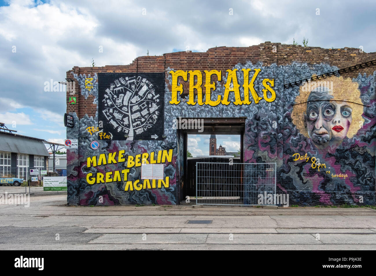 Berlin, Friedrichshain, RAW Gelände. Advertisement for Flic Flac circus show 'Freak' on crumbling old brick building wall Stock Photo