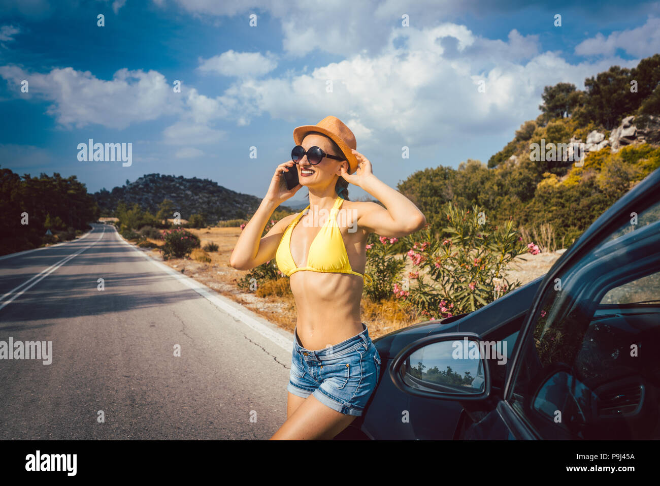 Woman using phone in her vacation Stock Photo