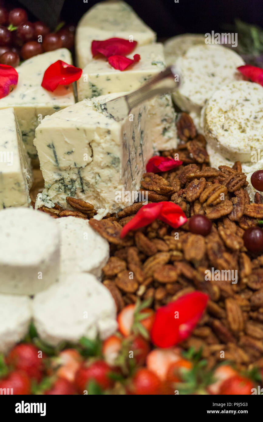 Blue cheese and candied walnuts display. Stock Photo