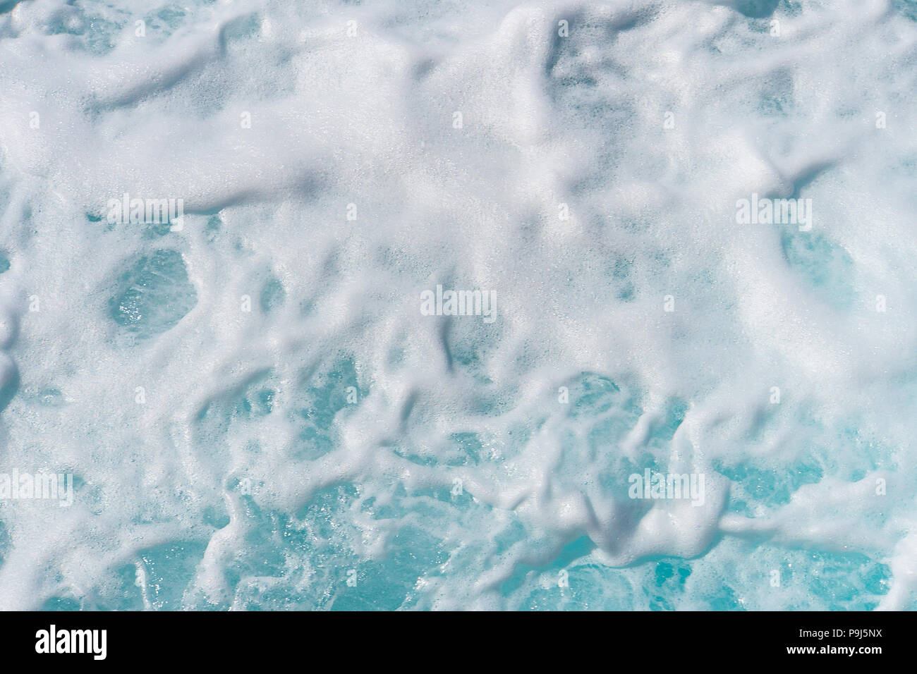 Still life of a large sponge with water and soapsuds on a slate table Stock  Photo - Alamy