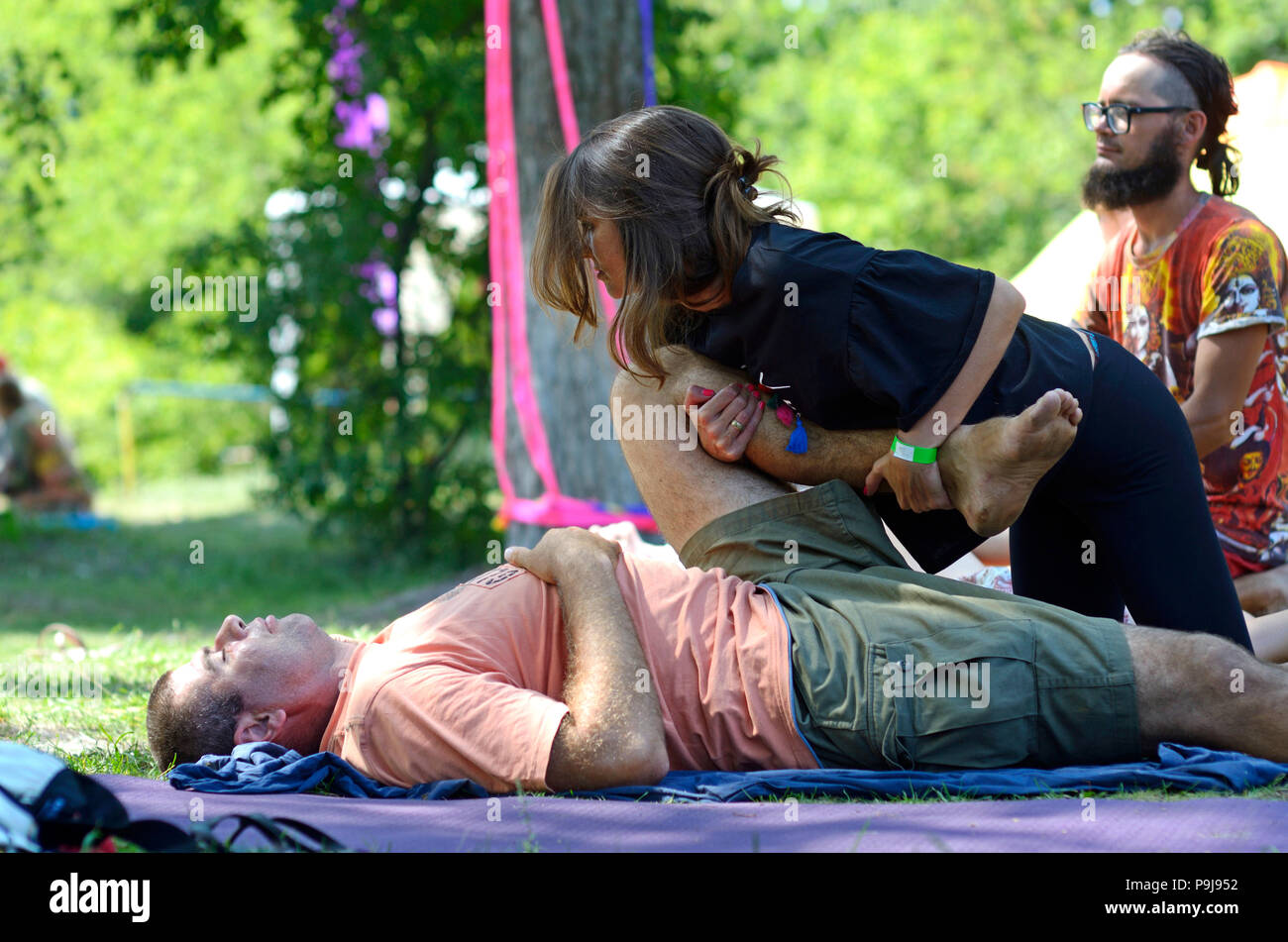 People practicing Thai massage during festival of Yoga and Vedic Culture  “Vedalife-2017, Island”. August 7, 2017. Kiev, Ukraine Stock Photo - Alamy